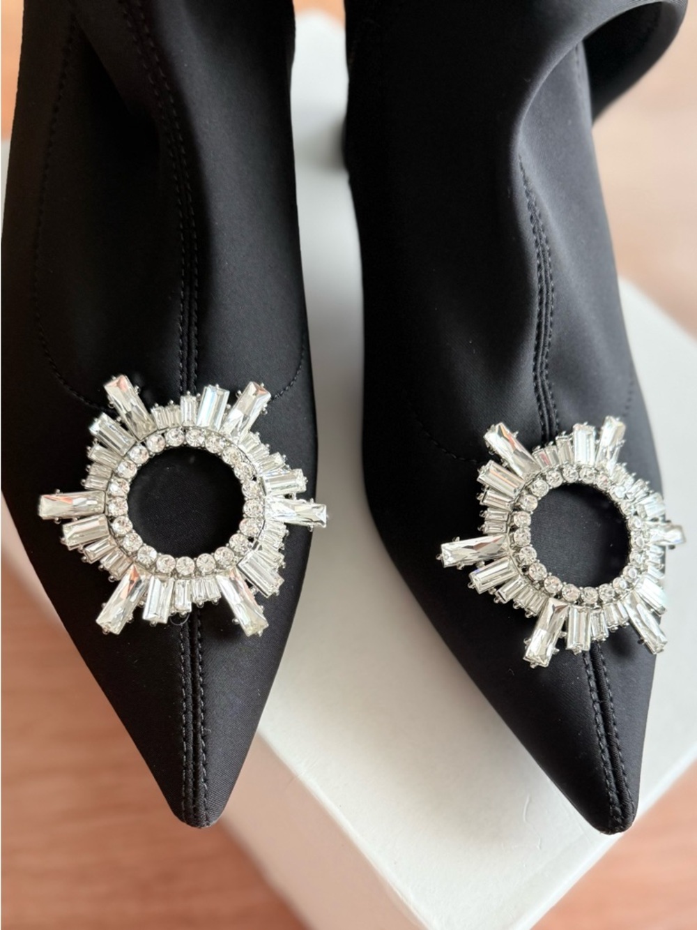 Black Pointed Stretch Sock Boots with Crystal Medallion